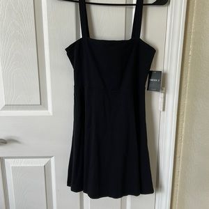 Forever 21, black dress with bow in back, never worn tags still on dress, medium